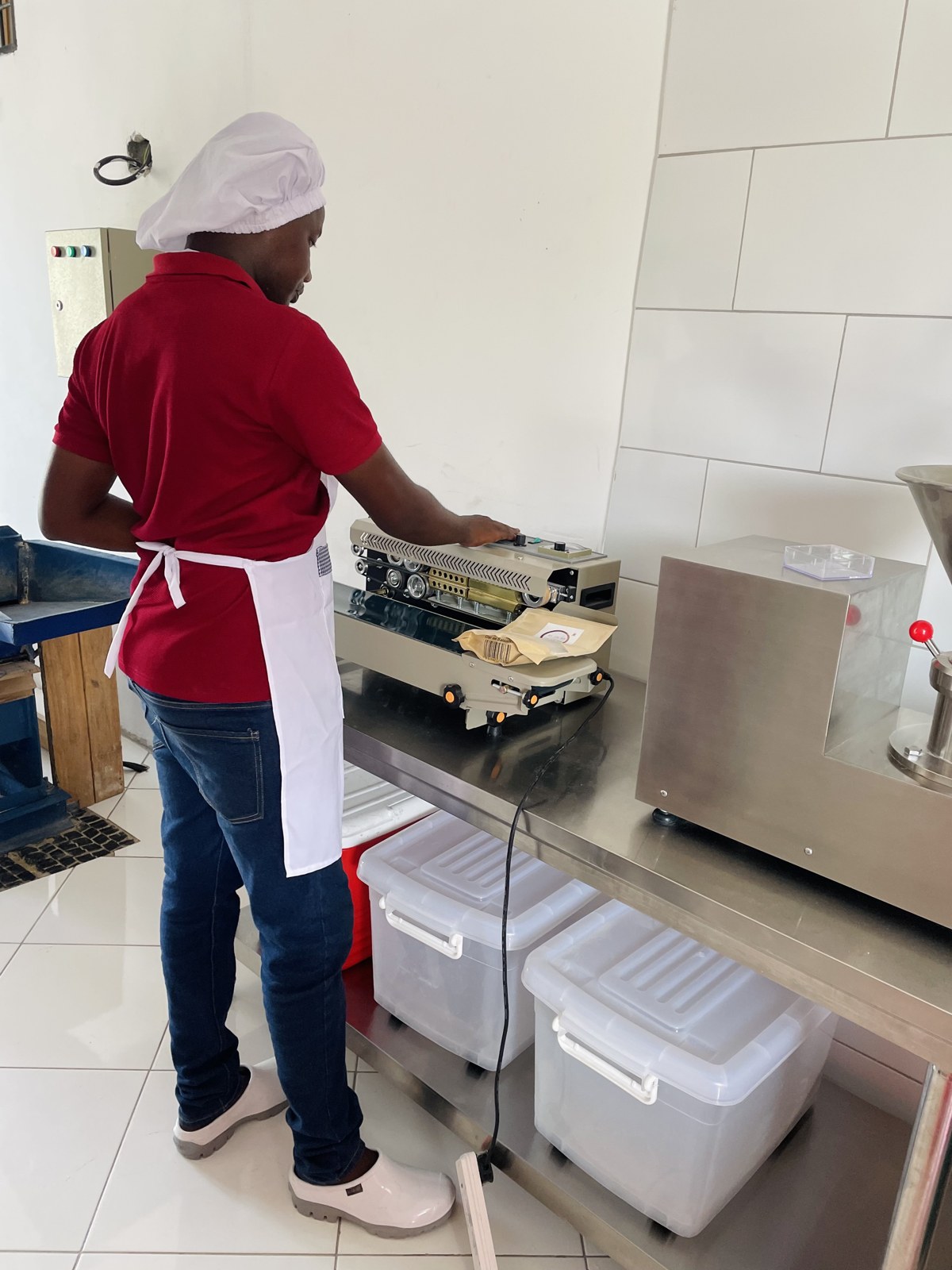A Lishe360 team member at work in the production area